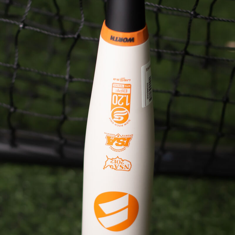 Orange USSSA logo stamped on a white Shannon Smith KReCHeR bat in a batting cage - SKU: WSU3SSX