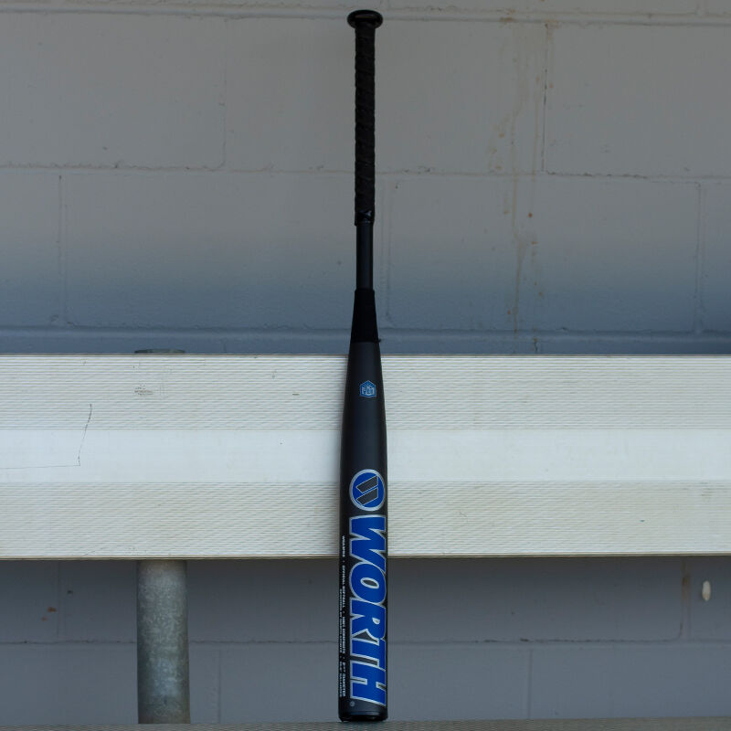 A Worth Freedom bat standing up on a dugout bench - SKU: WSA3FRB