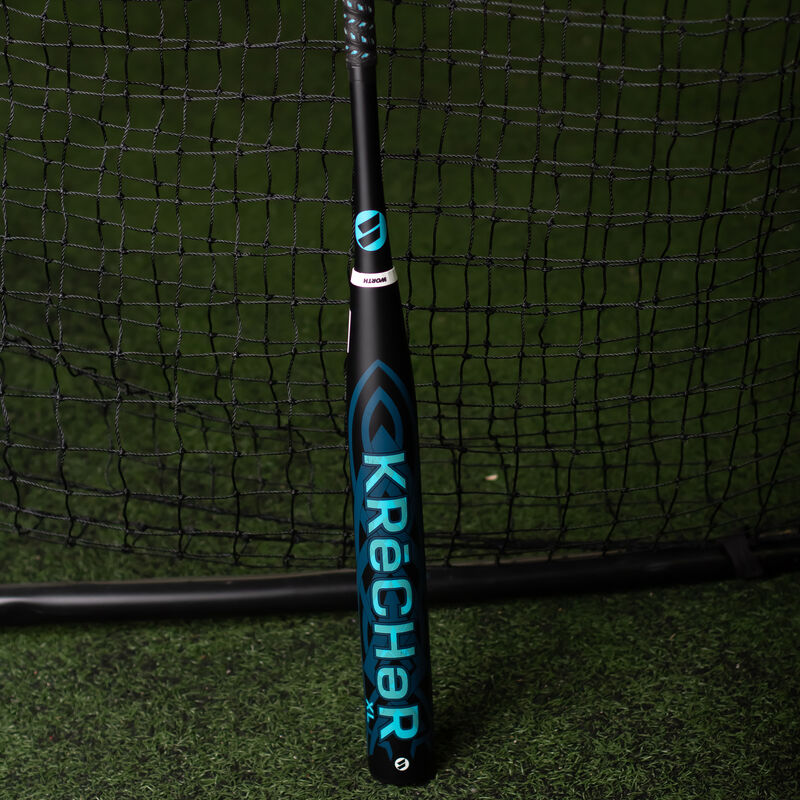 A black Worth 2023 KReCHeR USSSA bat in a batting cage - SKU: WSU3KRL loading=