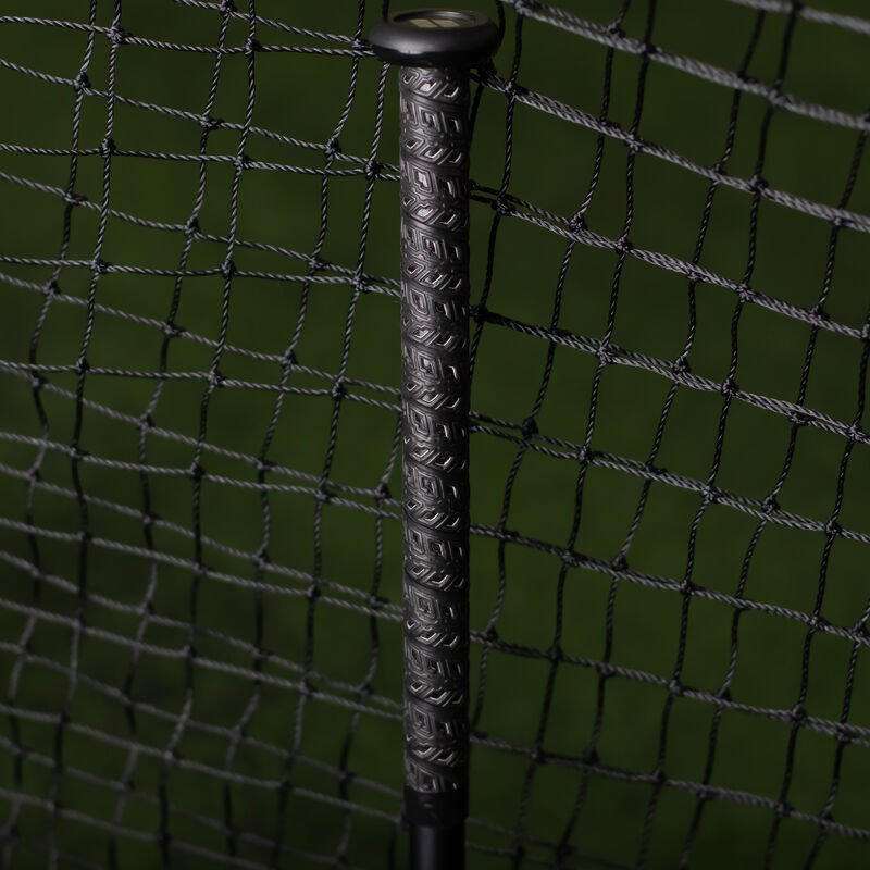 Black handle of a Worth KReCHeR USA bat in a batting cage - SKU: WSA3KRL