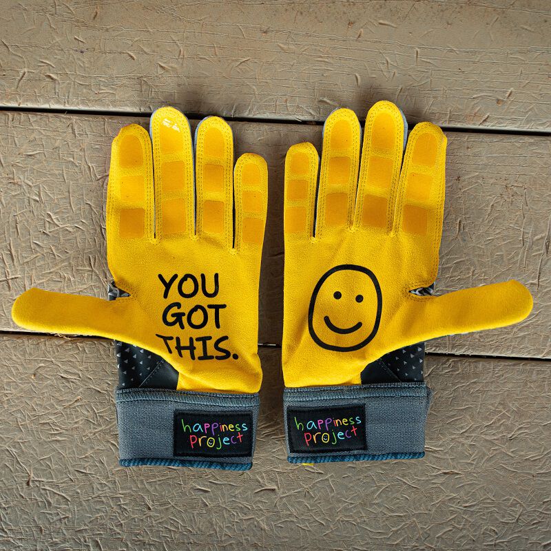 Picture of the yellow palms of a pair of black Easton x Happiness Project Ghost NX fastpitch batting gloves loading=
