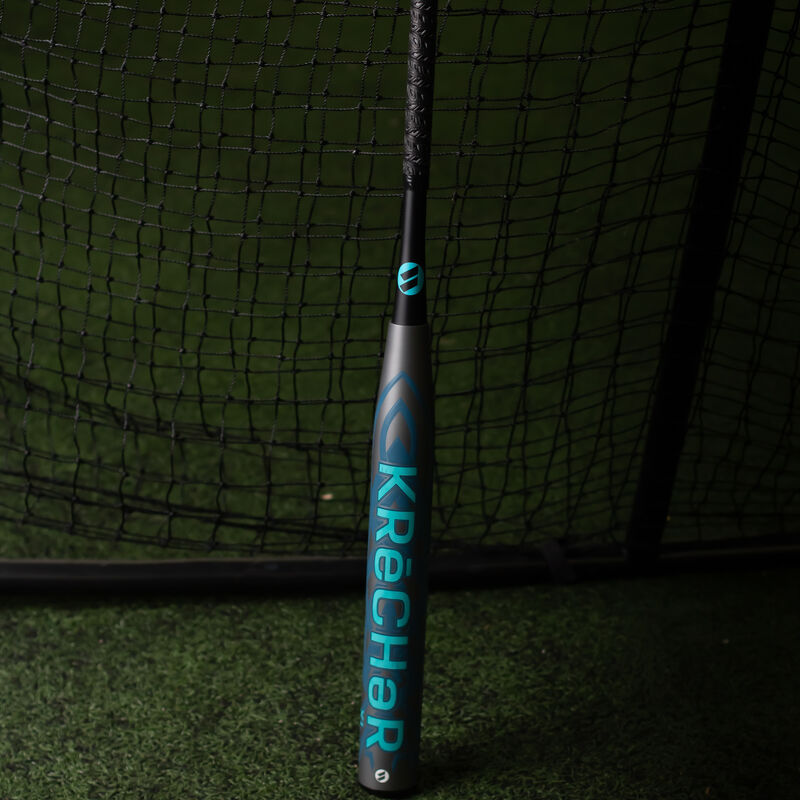 A grey 2023 KReCHeR XL USA bat in a batting cage - SKU: WSA3KRL