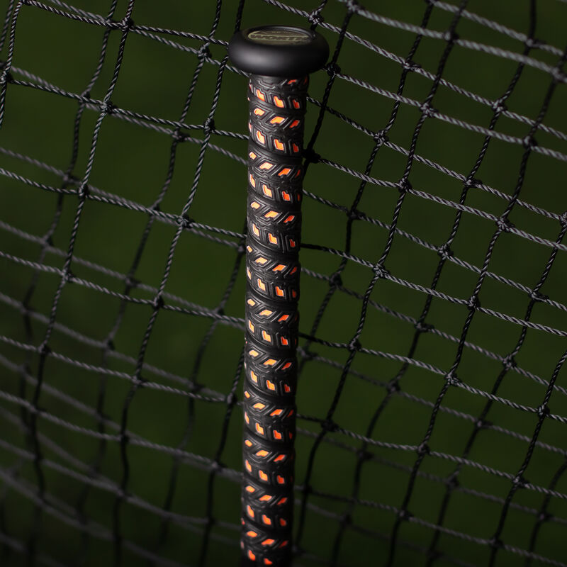 Black handle of a Worth Shannon Smith KReCHeR XL USSSA bat in a batting cage - SKU: WSU3SSX loading=